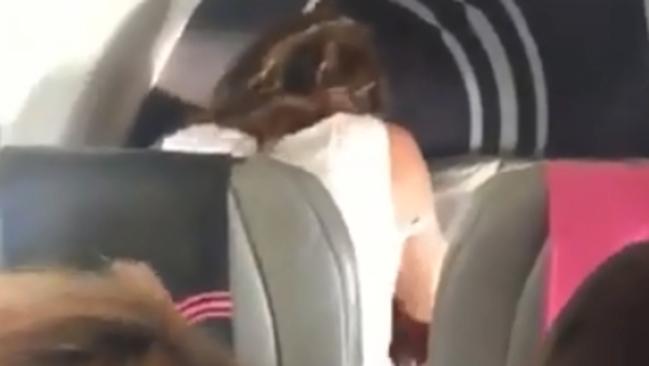 Couple filmed having sex on plane in full view of passengers. Picture: Caters News Agency