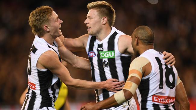 Magpies Jaidyn Stephenson, Jordan de Goey and Travis Varcoe