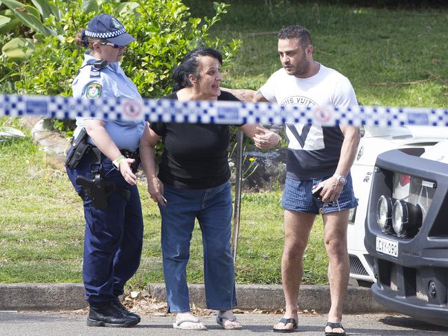 Mr Assaad’s mother is led away from the crime scene.