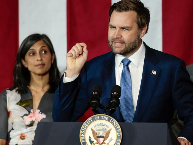 Usha Vance, left, watches her husband VP JD Vance during a speech in Michigan. Picture: AFP