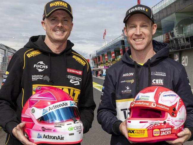 David Reynolds and Mark Winterbottom unveiled the limited-edition pink racing helmets which have been designed and painted by renowned helmet artist Trent Rogers. Picture: Supplied