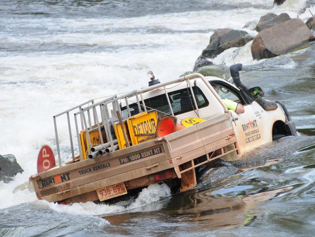 A four-wheel drive got stuck at Cahills Crossing in January 2012. PICTURE: Nigel Scullion