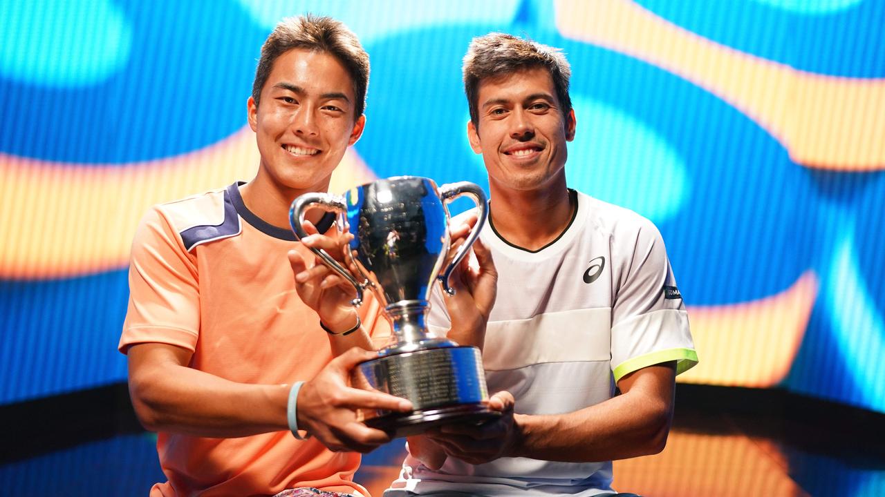 Rinky Hijikata and Jason Kubler with the trophy after victory in the 2023 Australian Open Men's Doubles Final. Picture: Tennis Australia/ Scott Barbour