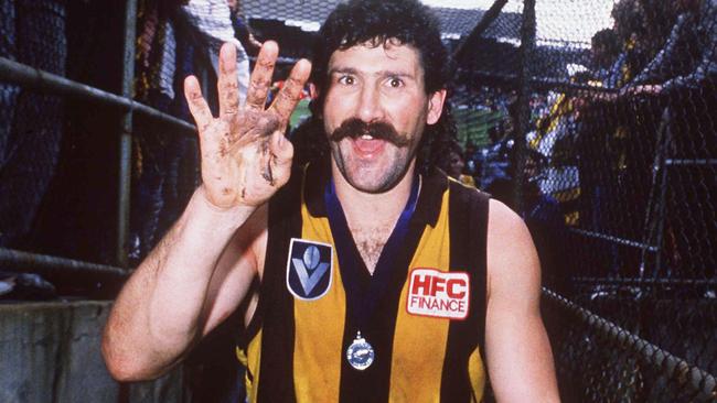 Robert DiPierdomenico enjoys his fourth VFL premiership as a Hawk.