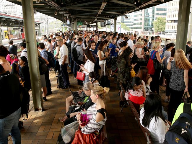 Thousands of commuters were left stranded on platforms after lightning strikes, staff calling in sick and track works combined for cancellation and delay of train services. Picture: Jonathan Ng