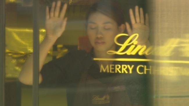 Elly Chen was forced to stand in the Lindt cafe window during the siege. Picture: Seven News