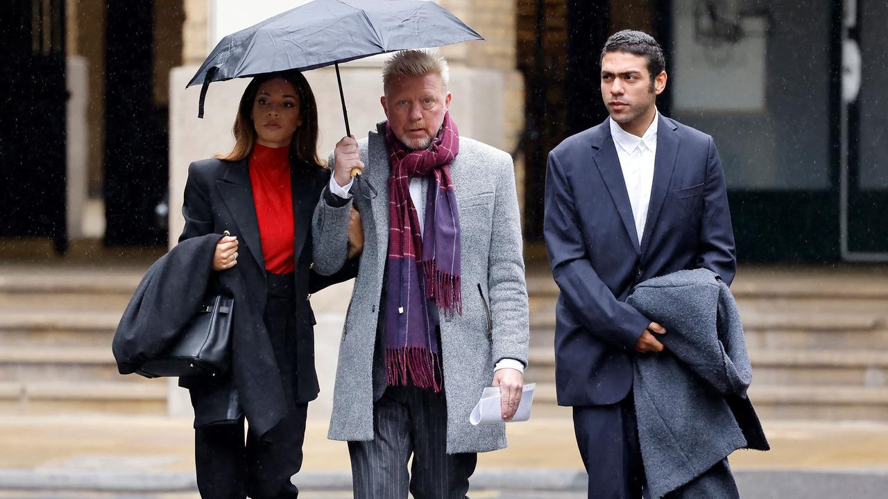 Boris Becker (C) and his partner Lilian de Carvalho Monteiro (L) arrive at Southwark Crown Court in London. (Photo by Tolga Akmen / AFP)