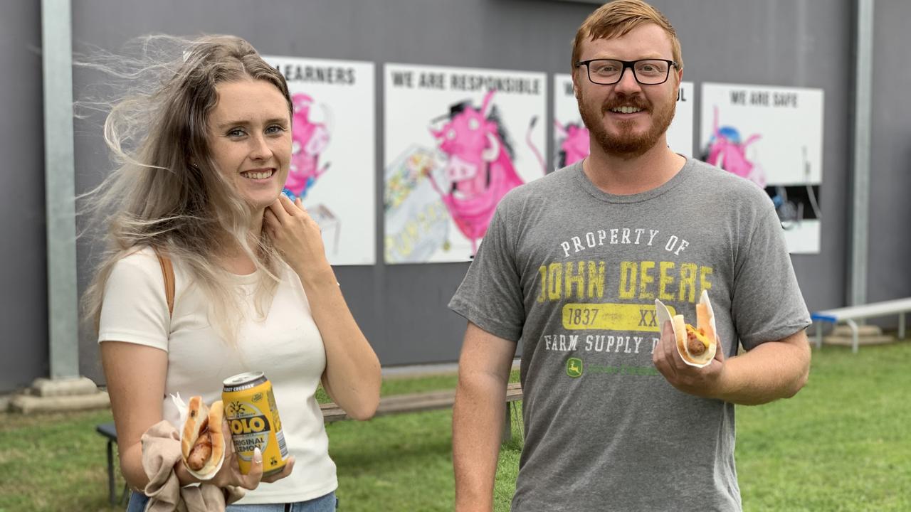 Kai Baldock and Scott Davis vote at Victoria Park State School and grab a snag afterwards at the Dawson federal election, May 21, 2022. Picture: Duncan Evans