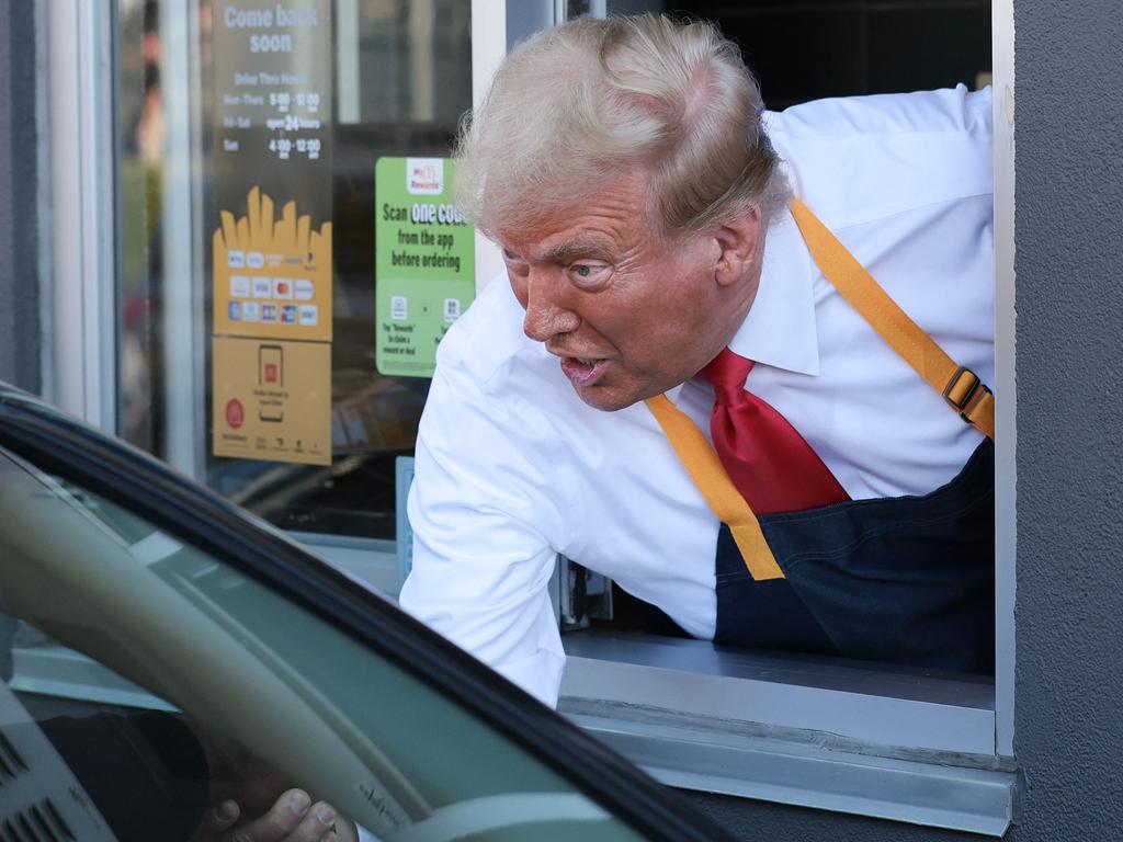 FEASTERVILLE-TREVOSE, PENNSYLVANIA - OCTOBER 20: Republican presidential nominee, former U.S. President Donald Trump works the drive-through line as he visits a McDonald's restaurant on October 20, 2024 in Feasterville-Trevose, Pennsylvania. Trump is campaigning the entire day in the state of Pennsylvania. Trump and Democratic presidential nominee Vice President Kamala Harris continue to campaign in battleground swing states ahead of the November 5th election.   Win McNamee/Getty Images/AFP (Photo by WIN MCNAMEE / GETTY IMAGES NORTH AMERICA / Getty Images via AFP)