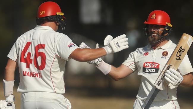 Ben Manenti congratulates Jake Lehmann after his century sealed the win. Picture: Daniel Pockett/Getty Images)