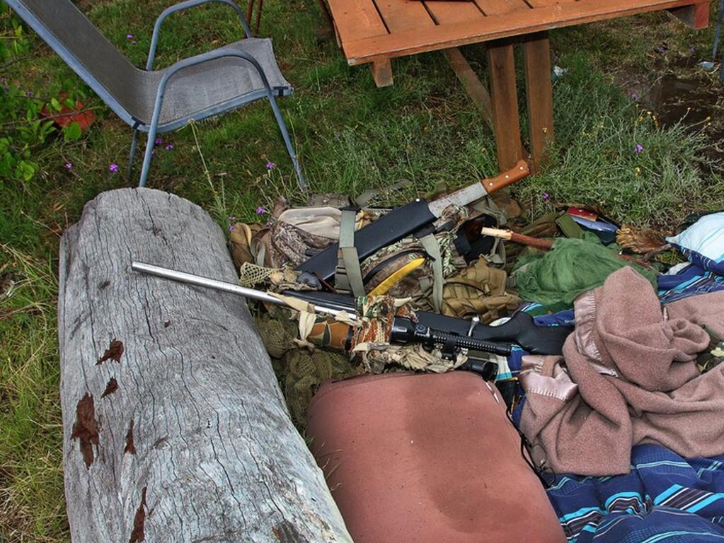 The sniper hide and weapons used by Nathaniel Train during the shootout with SERT officers on the evening of December 12, 2022.