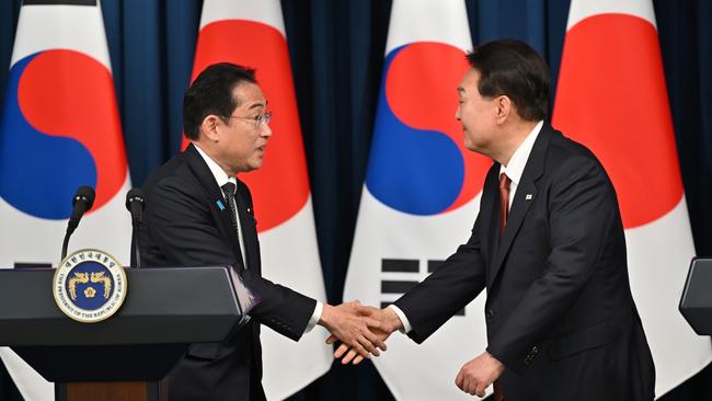 Yoon Suk-yeol, right, and Fumio Kishida shake on it in Seoul. Picture: Getty Images