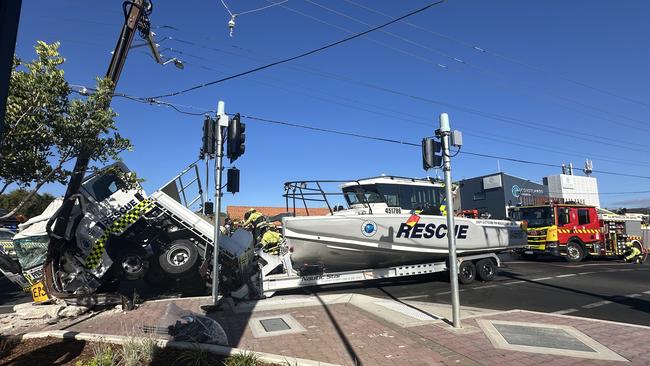 A truck from the SA Sea Rescue Squadron has crashed on Brighton road, with a rescue boat attached to the back.