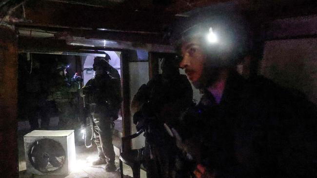 This picture taken during a media tour organised by the Israeli military on January 27, 2024, shows Israeli soldiers inspecting a tunnel, which had been dug by Hamas militants according to the Israeli army, in Gaza's main southern city of Khan Younis. Picture: AFP