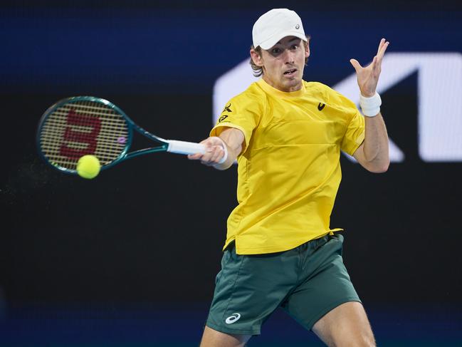 SYDNEY, AUSTRALIA - JANUARY 01: Alex De Minaur of Australia plays a forehand shot in the Group F match against Billy Harris of Great Britain during day six of the 2025 United Cup at Ken Rosewall Arena on January 01, 2025 in Sydney, Australia. (Photo by Brett Hemmings/Getty Images)