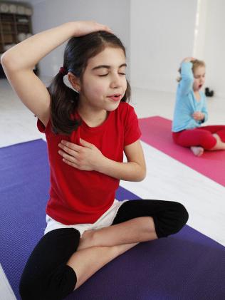 Six week old kids chill out with yoga | Daily Telegraph