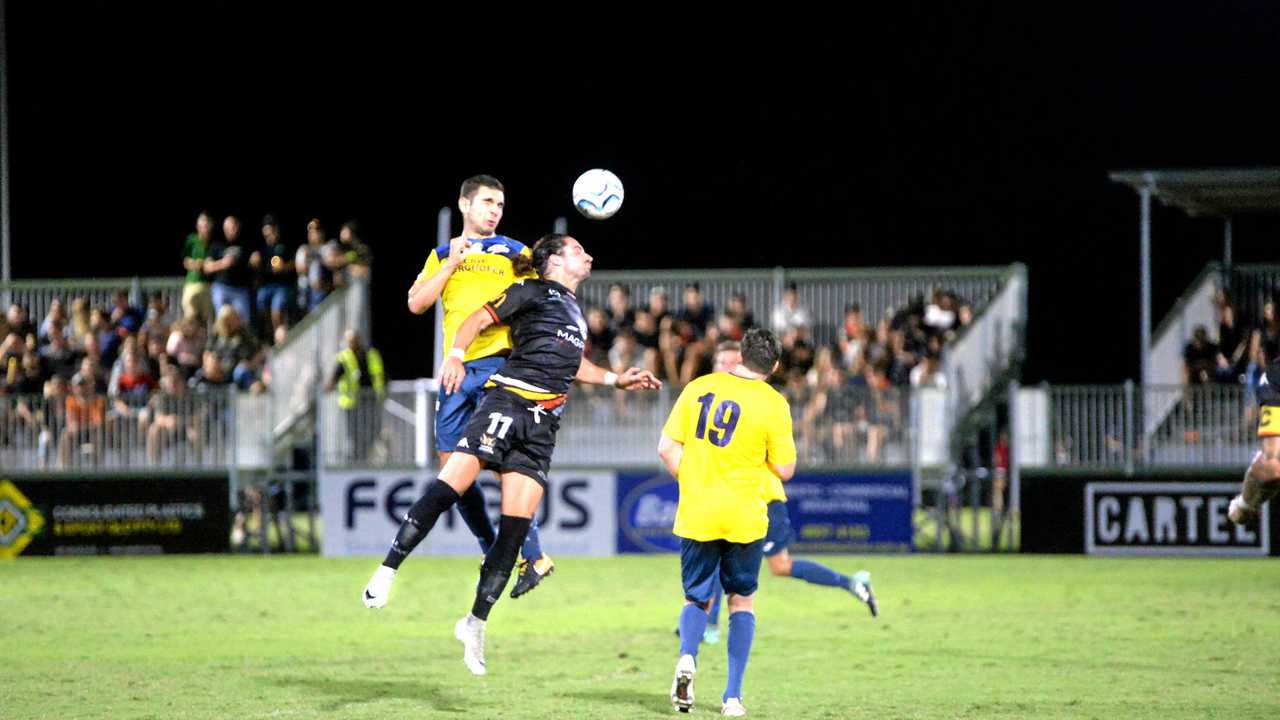 NPL THRILLER: South West Queensland Thunder's Keagan Sheridan (left) contests a high ball with Magpies Crusaders striker Kyle Markham. The Thunder won the NPL clash 4-3 after trailing 2-0 at halftime. Picture: Daniel McKenzie