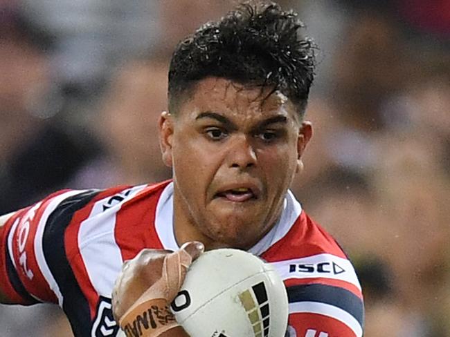 Latrell Mitchell of the Roosters evades a tackle by Corey Horsburgh of the Raiders during the 2019 NRL Grand Final between the Canberra Raiders and the Sydney Roosters at ANZ Stadium in Sydney, Sunday, October 6, 2019. (AAP Image/Dean Lewins) NO ARCHIVING, EDITORIAL USE ONLY