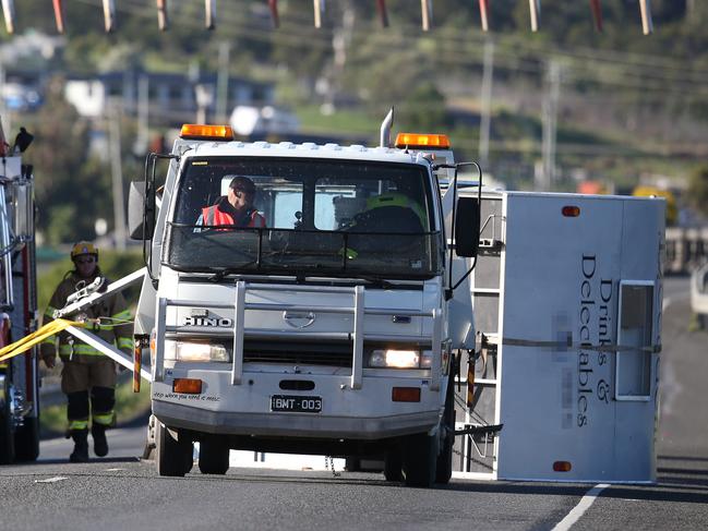 Caravan blown over by high winds on the Bridgewater Bridge Bridgewater. Tasmania Police, Tasmania Fire Service and SES in attendance. Picture: NIKKI DAVIS-JONES