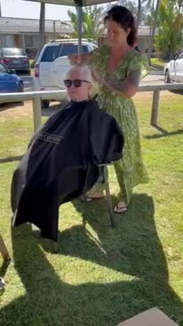 Sarina woman Karen Mayes getting her hair cut to raise funds for Cancer Council