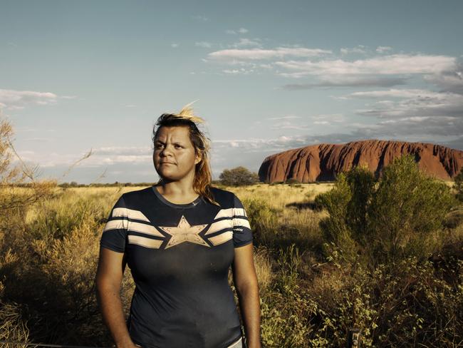 Wanatjura Patterson, 25, in front of Uluru in the Northern Territory. PIC: Justine Walpole