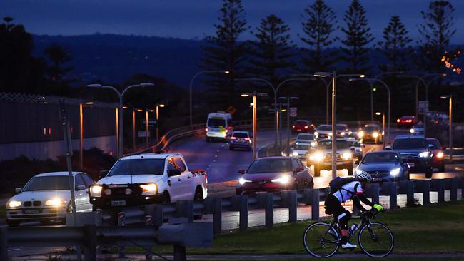 Early morning traffic on Tapleys Hill Rd at West Beach. Photo: AAP/Mark Brake