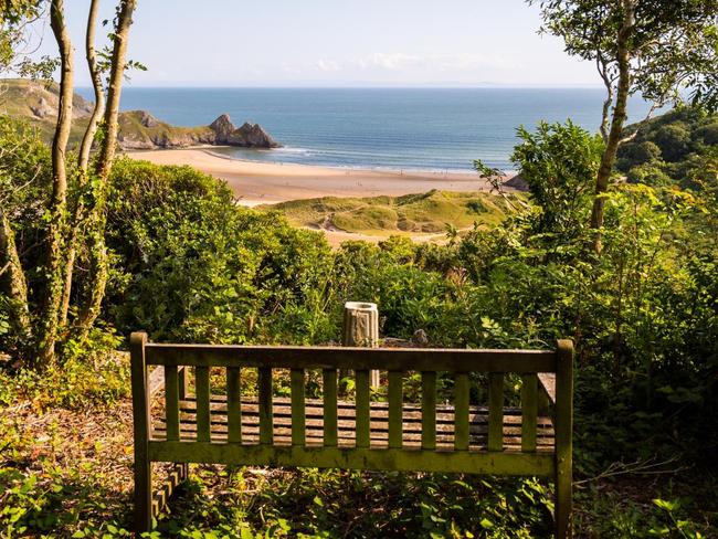 A wooden bench on a clifftop is up for sale for £500,000 - because it boasts breathtaking views of one of Britain's best beaches.The old bench perched on a coastal edge is all that is left of a ramshackle wooden cabin put up more than 50 years ago.But the cabin was demolished - and the site overlooking Three Cliffs Bay on the stunning Gower Coast in Wales is now going under the hammer.Pictured here is the view from the plotWALES NEWS SERVICE