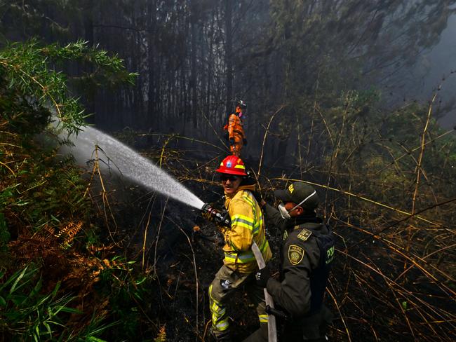 Rescue teams battle a fierce forest fire in Nemocon, Colombia, amidst a spate of blazes linked to El Niño-driven temperature highs. Picture: Luis Acosta/AFP