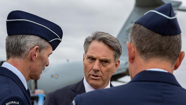 Deputy Prime Minister Richard Marles, centre, speaks with RAAF Chief of Air Force Robert Chipman, left, earlier this month at the Avalon Air Show. Picture: Getty Images