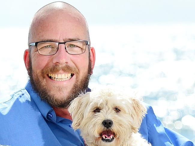 Pride of Australia: Veteran police dispatcher Rob Barton, played a key role in helping police arrest an alleged offender whilst walking his dogs at Frankston beach. Rob with his two dogs Jorja and Tilly.Picture : Nicki Connolly