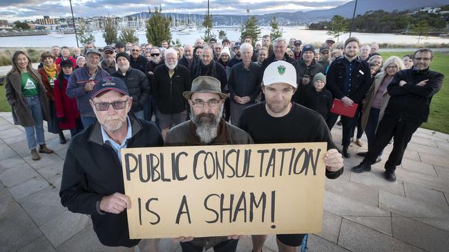 Rosny Golf Club members Peter Miller, left, Andrew Miller and Matt Potter with other attendees at the public meeting to save the golf course. Picture: Chris Kidd