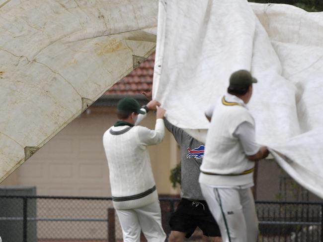 VTCA Cricket: Kookaburra Sports/Turner Shield, Round 11: Airport West St Christophers 1st XI vs Yarraville Club 1st XI, played at Etzel Street Reserve, Airport West, Victoria, Saturday 15th February 2025. The covers come out during the storm. Picture: Andrew Batsch