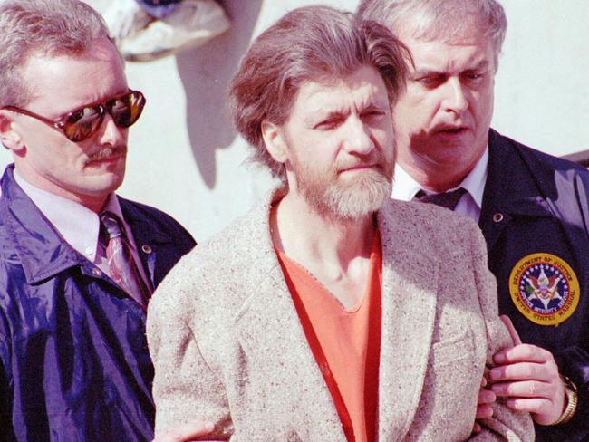 Theodore John Kaczynski is flanked by federal agents as he is led to a car from the federal courthouse in Helena/Mont.,  Apr 04,1996 the suspected Unabomber, was charged with one count of possession of bomb components.   AP Photo/John/Youngbear headshot crime o/seas bombing usa murder