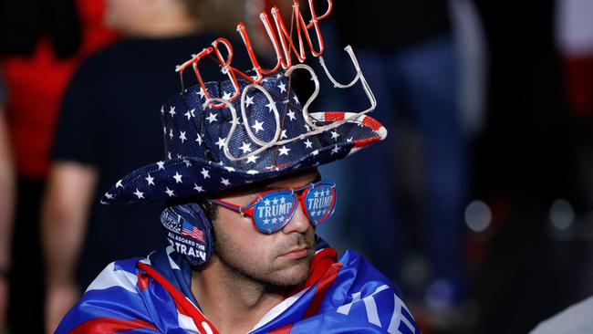 A man attends a former US President Donald Trump's Save America rally at Macomb County Community College Sports and Expo Center in Warren, Michigan, on October 1, 2022. (Photo by JEFF KOWALSKY / AFP)