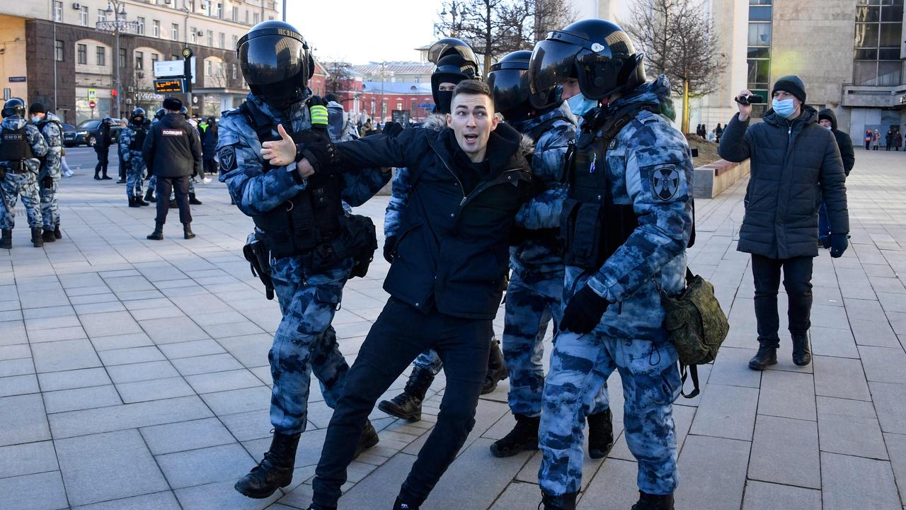 Police officers detain a man during a protest against Russia's invasion of Ukraine in central Moscow. Picture: Alexander Nemenov / AFP