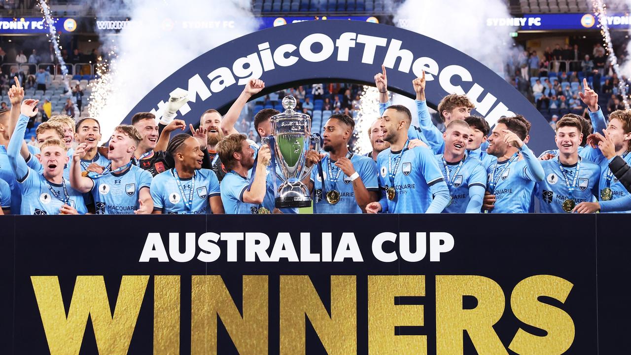 SYDNEY, AUSTRALIA - OCTOBER 07: Luke Brattan of Sydney FC lifts the Australia Cup trophy and celebrates victory 1with team mates after the 2023 Australia Cup Final match between Sydney FC and Brisbane Roar FC at Allianz Stadium on October 07, 2023 in Sydney, Australia. (Photo by Matt King/Getty Images)