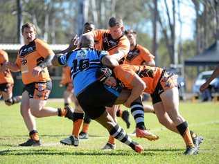 TACKLE: Serupepeli Natui is tackled down by Avondales Blake Andrew Santalucia. Picture: Brian Cassidy