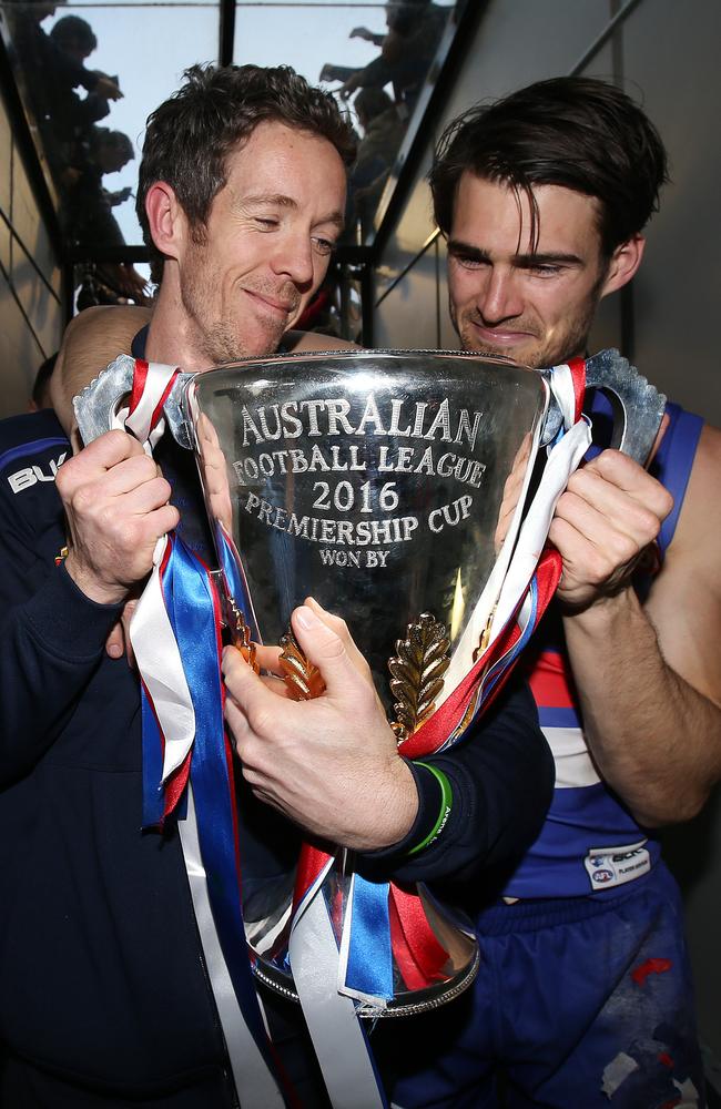 Bob Murphy and Easton Wood leave the field with the cup. Picture: Michel Klein