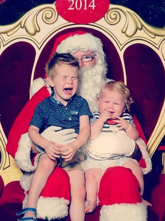 Ashlee Cox: My two boys in 2014. Brodie (3) and Logan (10 months) weren't too happy to meet Santa that year. Santa looks like he had had enough for the season too.