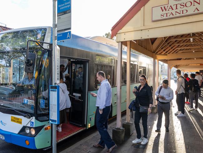 Lines of commuters at Watson St Neutral Bay waiting for their bus. Picture: Thomas Lisson