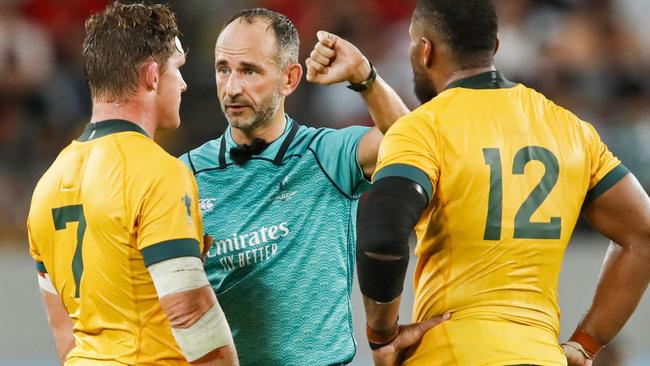 Michael Hooper and Samu Kerevi listen to Romain Poite. Picture: AFP Photo