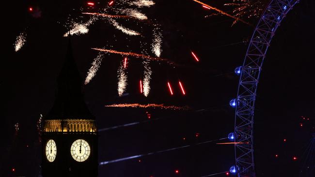 Fireworks explode in the sky around the London Eye and The Elizabeth Tower. Picture: AFP