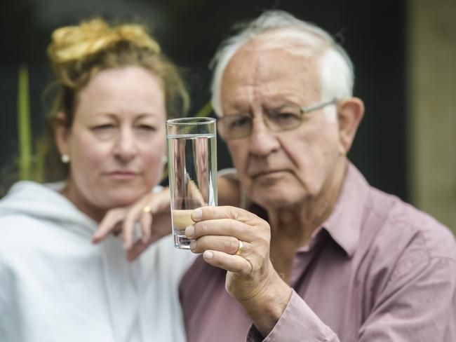 Chloramine in the water at Encounter Bay Victor Harbour. Melissa Clissold visiting from Sydney with John Stankovich with a glass of water from his tap which he wonÃt drink.Friday January 07 2022 Picture:  Roy VanDerVegt