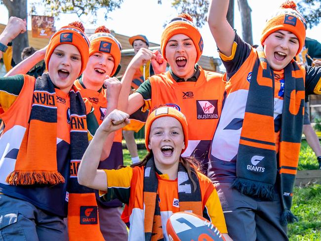 PARRAMATTA ADVERTISER / AAPYear 6 GWS Giants fans Front Sienna Rudd, back L-R Alex Vickers, Lachlan Vickers, Trent Seymour, Nicholas Decelis pose for a photo at Winston Hills Public School on Tuesday, 24 September 2019. (AAP IMAGE / MONIQUE HARMER)