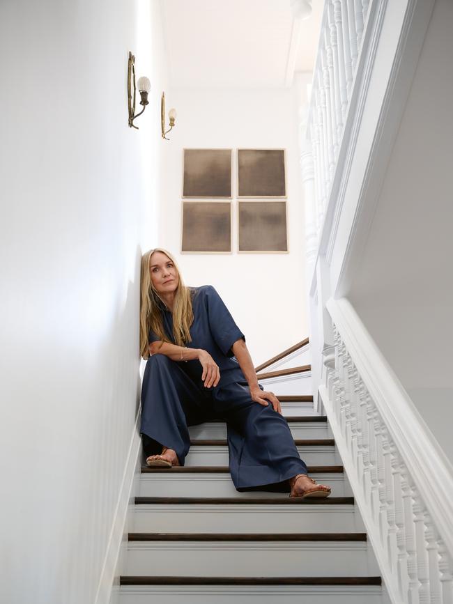 Dinnigan, whose special skill is spaces that are at once sumptuous yet informal, wears Jac+Jack shirt and pants, Jimmy Choo shoes, Paspaley white gold, diamond and Australian South Sea pearl Keshi Chain bracelet. Also shown: artwork by Marisa Purcell. Styling Nicole Bonython-Hines. Picture: Earl Carter