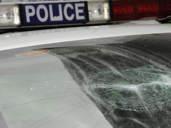 Police car damaged by several youths who were caught,  Damage includes dents all round & smashed windscreen.