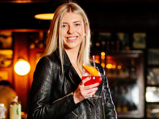 Bronte Pendergast, 19, from Concord enjoying a NOgroni, a Negroni made without alcohol at The Baxter Inn in Sydney. Picture: Jonathan Ng