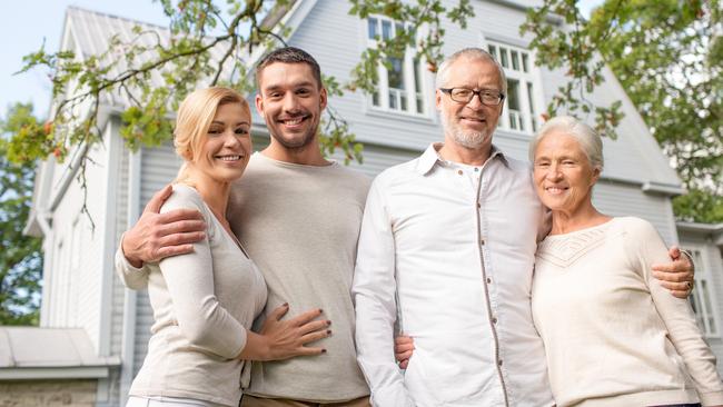 family, happiness, generation, home and people concept - happy family standing in front of house outdoors; Bank of Mum and Dad generic money