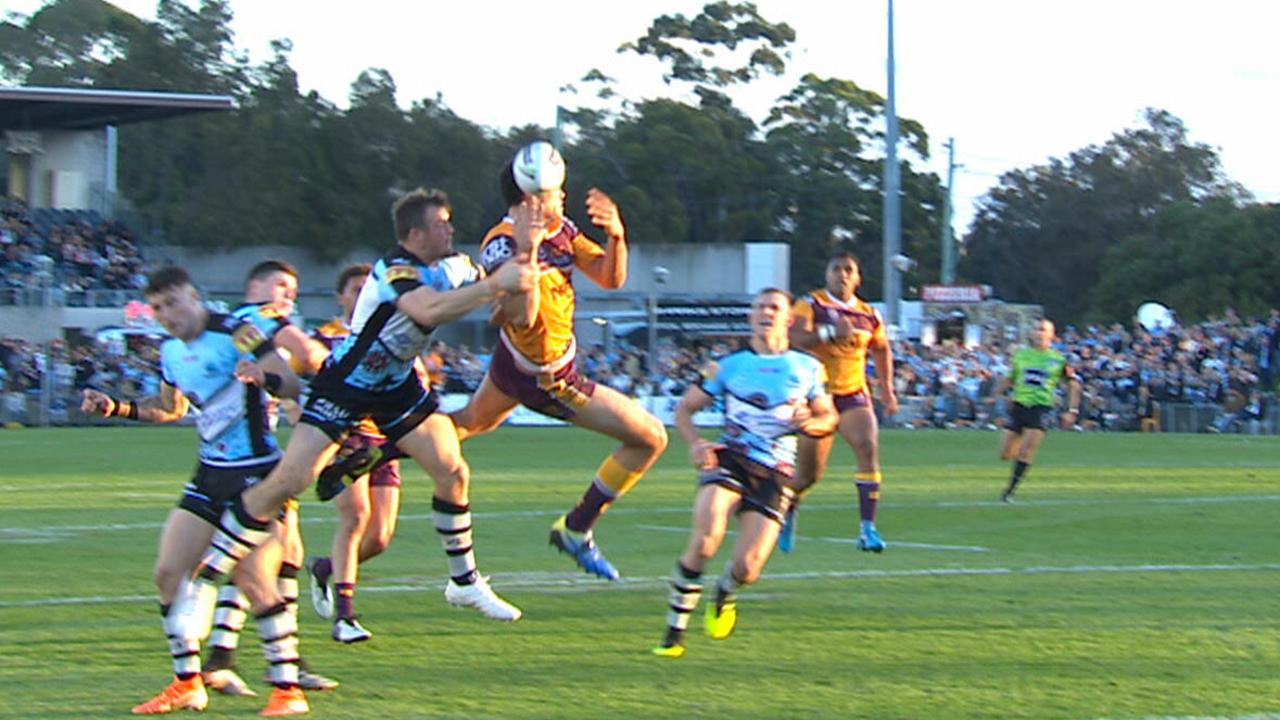 Coates soars to contest a cross-field bomb.