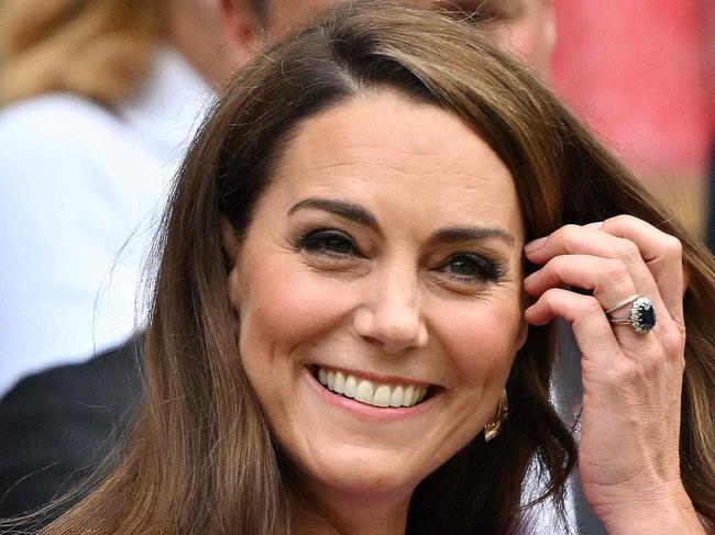 TOPSHOT - Britain's Catherine, Princess of Wales reacts as she arrives in the Royal Box on Centre Court to attend the men's singles final tennis match on the fourteenth day of the 2024 Wimbledon Championships at The All England Lawn Tennis and Croquet Club in Wimbledon, southwest London, on July 14, 2024. (Photo by ANDREJ ISAKOVIC / AFP) / RESTRICTED TO EDITORIAL USE